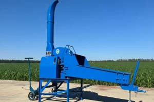 Blue chaff cutter for silage; boosts farm efficiency with fast forage shredding.