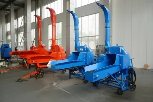 Four chaff cutters in red and blue colors lined up in a factory setting