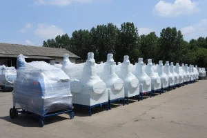 Rows of chaff cutter machines wrapped in protective plastic packaging, prepared for shipment.