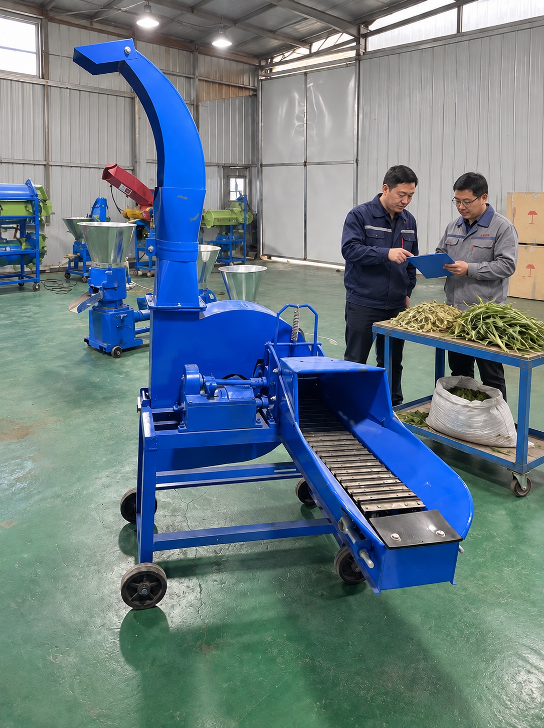 Supplier discussion beside the supplied conveyor-fed machine with material samples and a configuration checklist