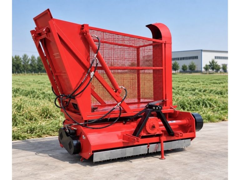 Grass Silage Harvester with a lowered collection hopper beside a forage field