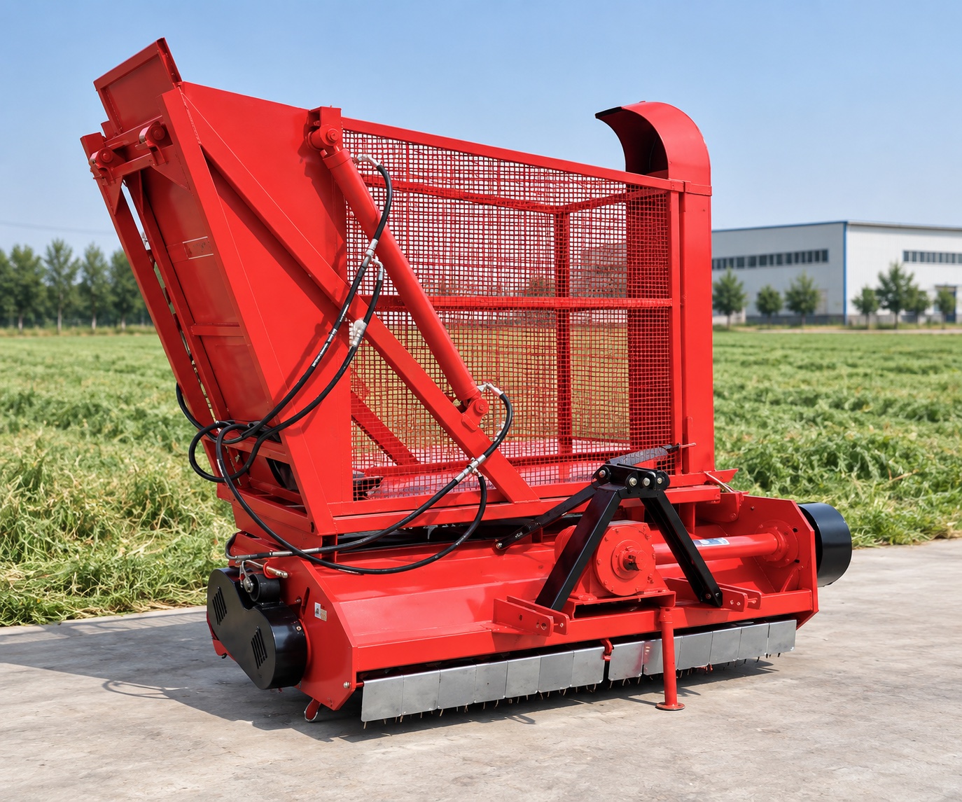 Grass Silage Harvester with a lowered collection hopper beside a demonstration field
