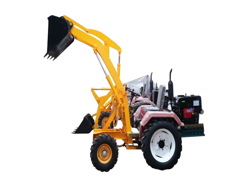 Mini front end loader bucket raised on the GC-06 grass loader
