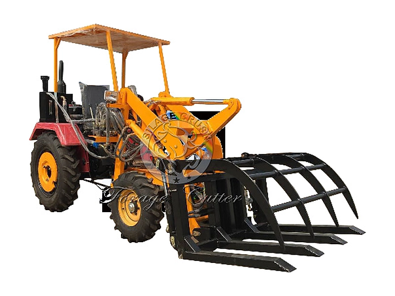 Grass loader fitted with curved hay grapple and fork tines for straw and forage