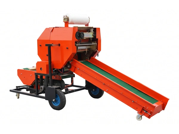 Rear side view of the FC-585 silage baler showing the long rubber-belt feed conveyor