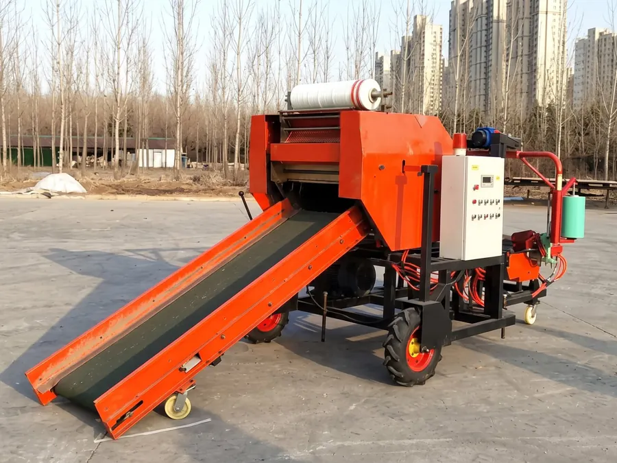 FC-585 mini round silage baler and wrapper with net roll, feed conveyor, control cabinet and film dispenser in the factory yard