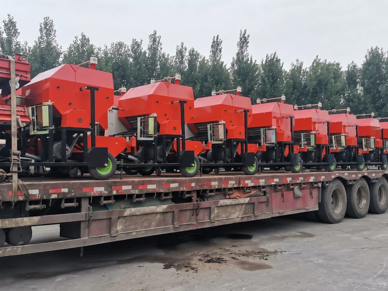 Flatbed truck loaded with a batch of FC-585 silage balers strapped down for dispatch to port