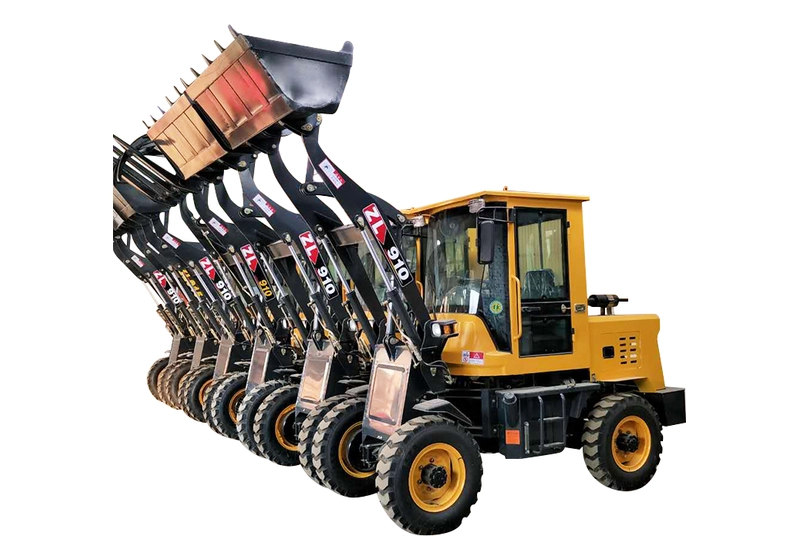 Row of compact wheel loaders with raised buckets lined up for dispatch