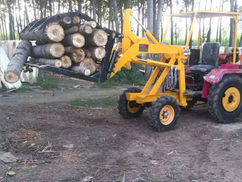 Grass loader lifting a bundle of logs with its grapple at a timber yard